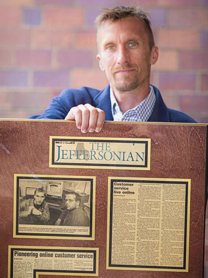 Nick Collins holding The Jeffersonian article from November 2001 about WebSupportLive pioneering online customer service